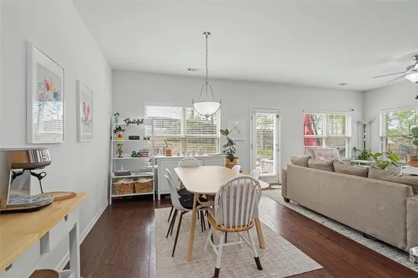 a dining room with furniture and window
