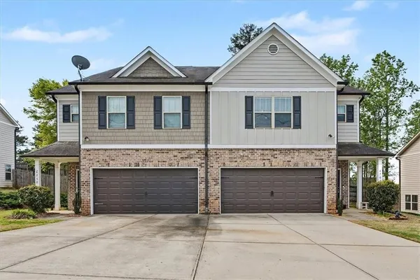 front view of a house with yard