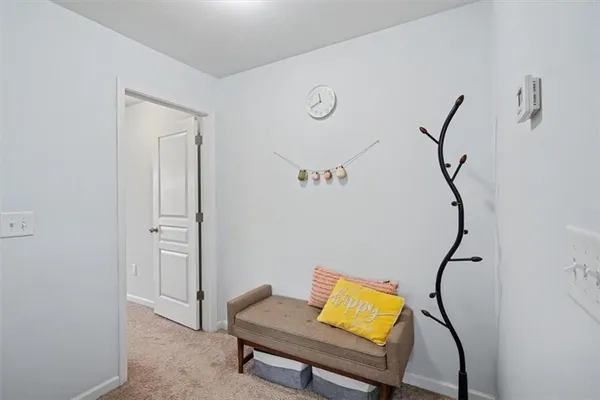 a view of a room with wooden floor and windows