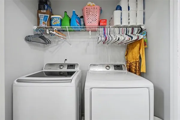 a utility room with dryer and washer