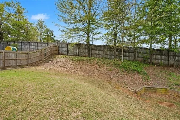 an aerial view of a house with outdoor space