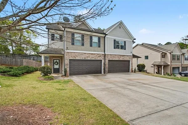 a front view of a house with a yard