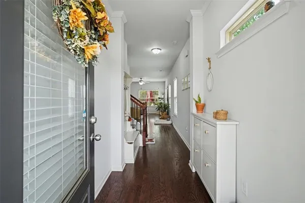 a view of hallway with wooden floor