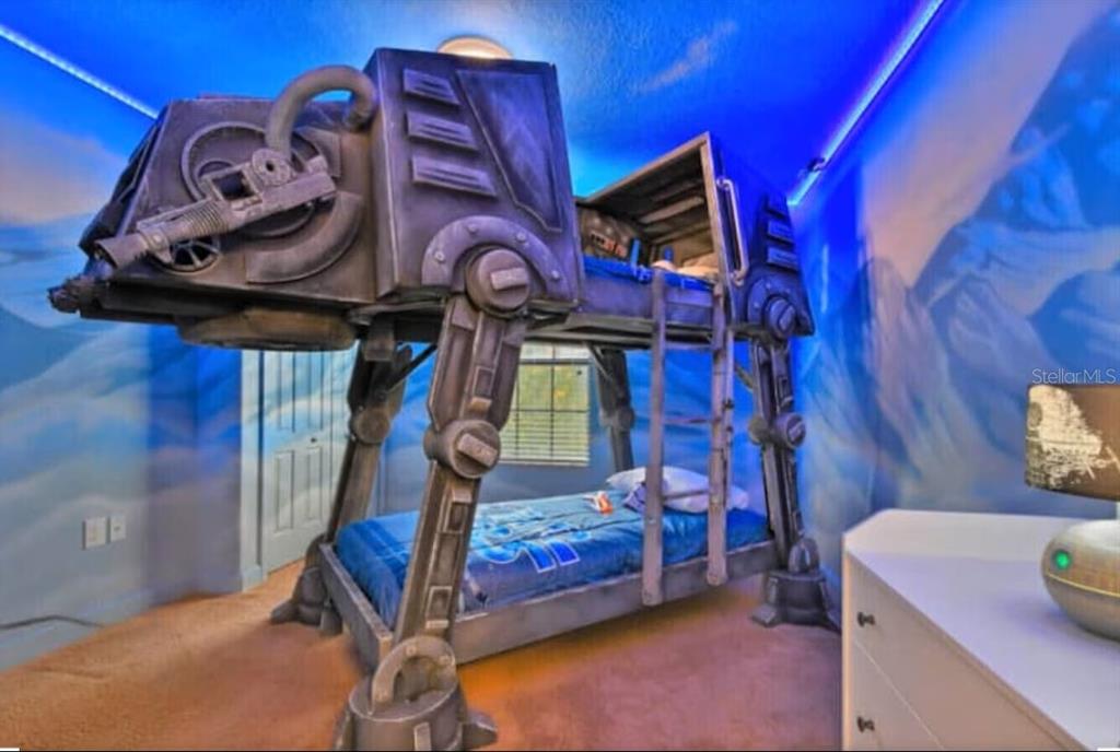 1424 Thunderbird Road Davenport, FL 33896 - Photo 12 of 22 a bedroom with a bed and a baby