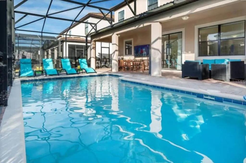 1424 Thunderbird Road Davenport, FL 33896 - Photo 3 of 22 a view of swimming pool with outdoor seating