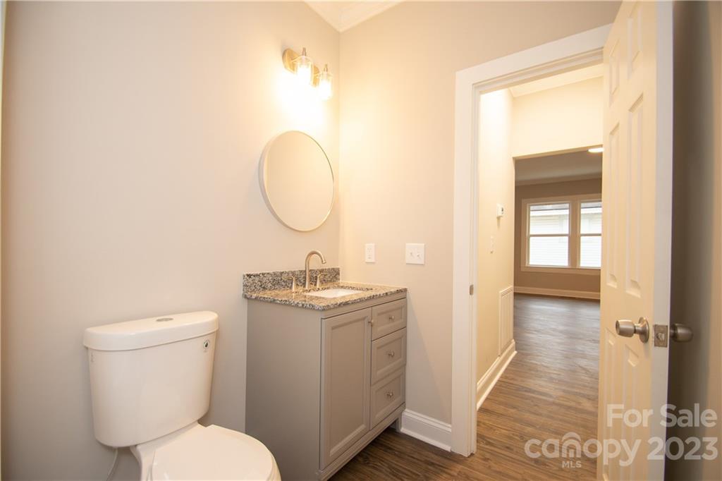 1257 Springdale Road Lancaster, SC 29720 - Photo 16 of 18 a bathroom with a toilet a sink and mirror