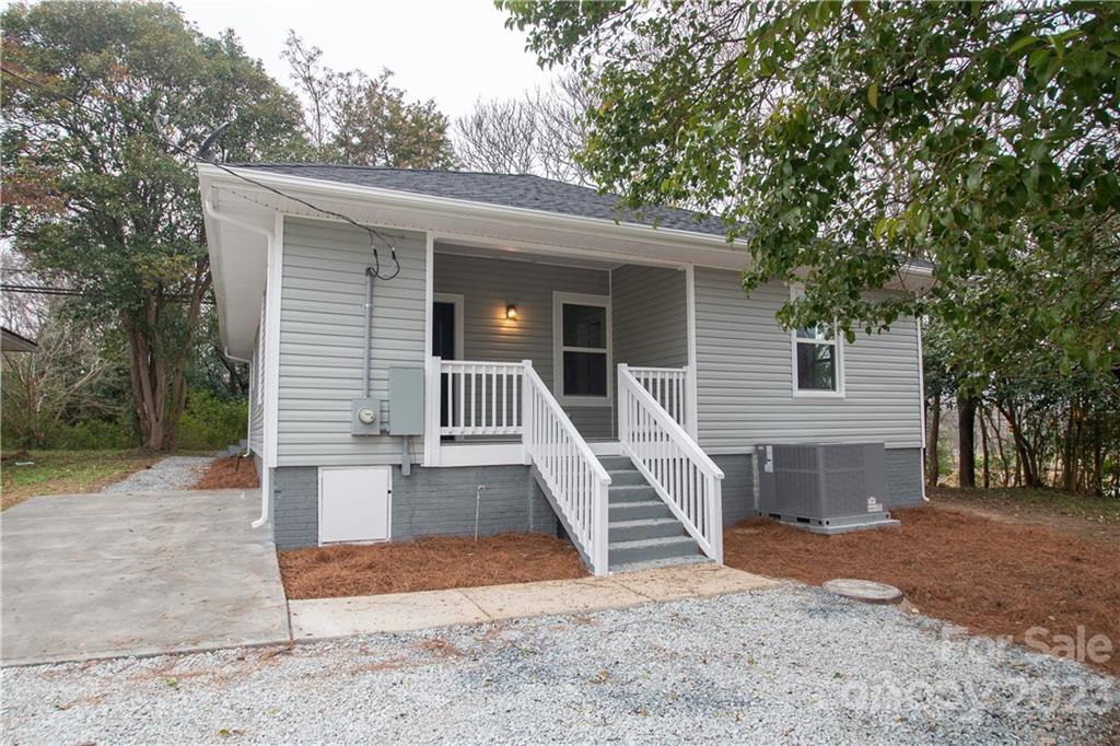 1257 Springdale Road Lancaster, SC 29720 - Photo 2 of 18 a view of a house with a small yard and large tree