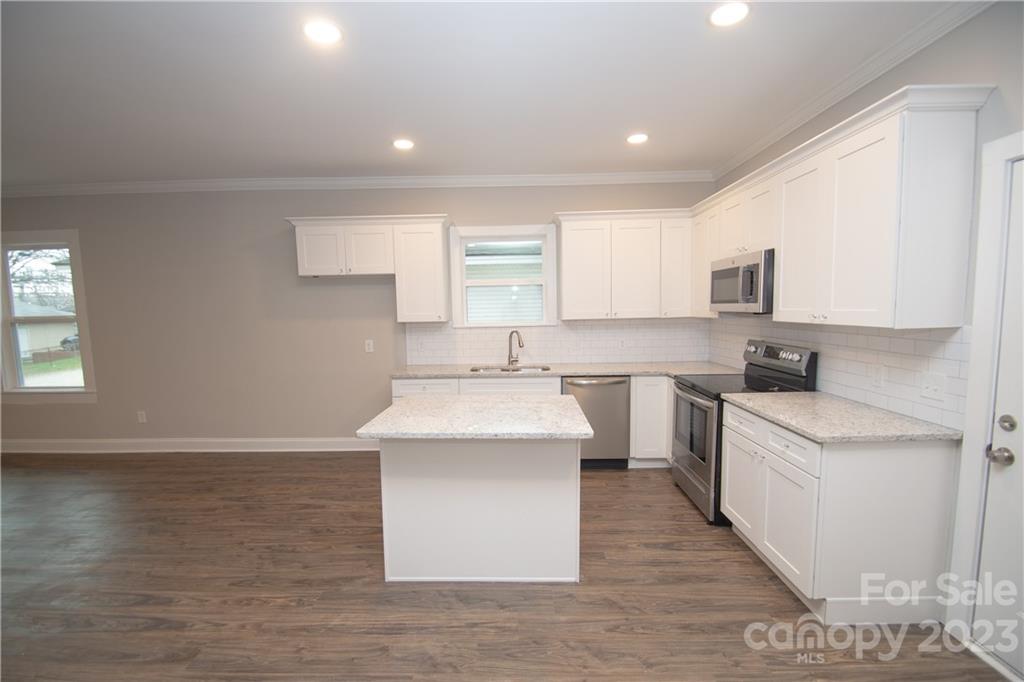 1257 Springdale Road Lancaster, SC 29720 - Photo 8 of 18 a kitchen with a sink cabinets and window