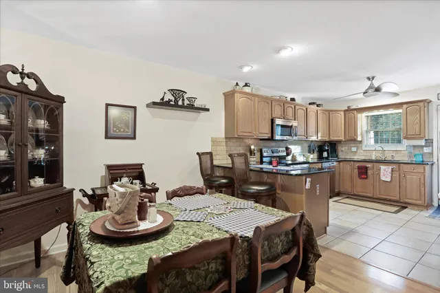 a kitchen with a table and chairs
