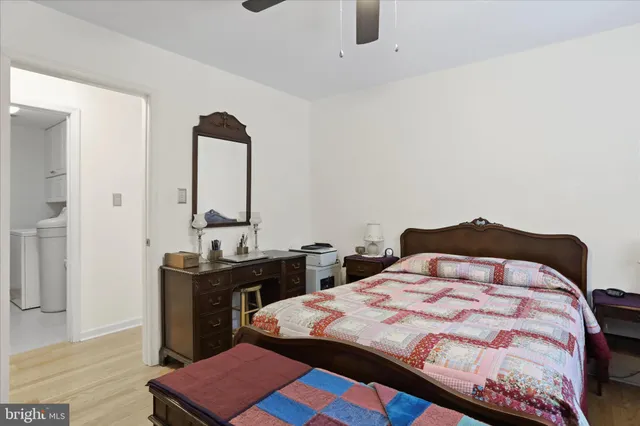 a bedroom with a bed and a table in it