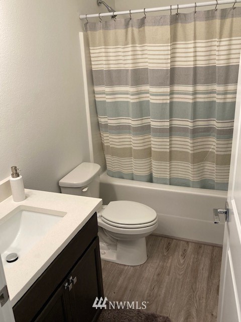 4865 Talbot Road South, Unit B4 Renton, WA 98055 - Photo 33 of 33 a bathroom with a sink a toilet and shower