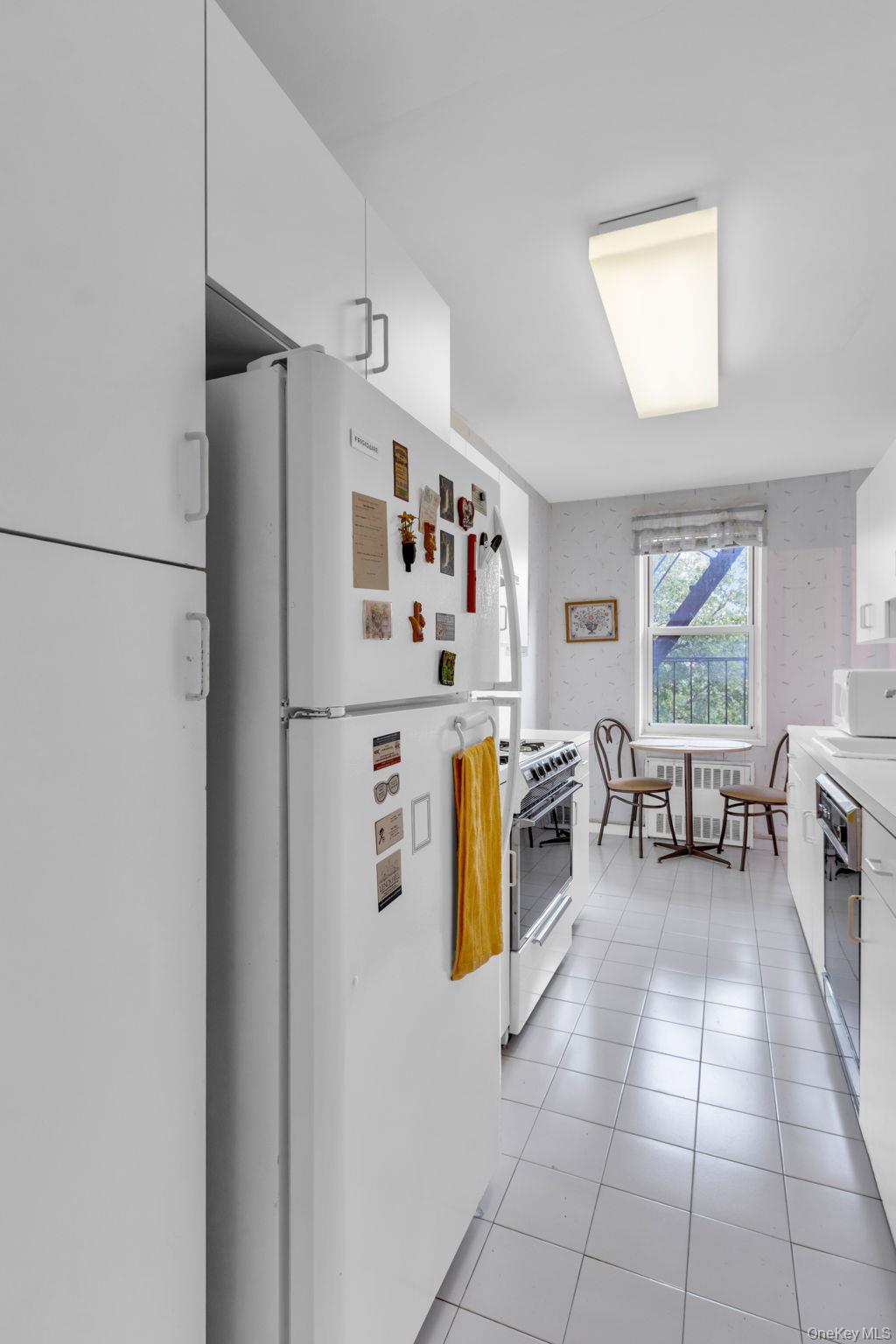 3901 Independence Avenue, Unit 4R Bronx, NY 10463 - Photo 11 of 35 a kitchen with stainless steel appliances granite countertop a refrigerator and a sink
