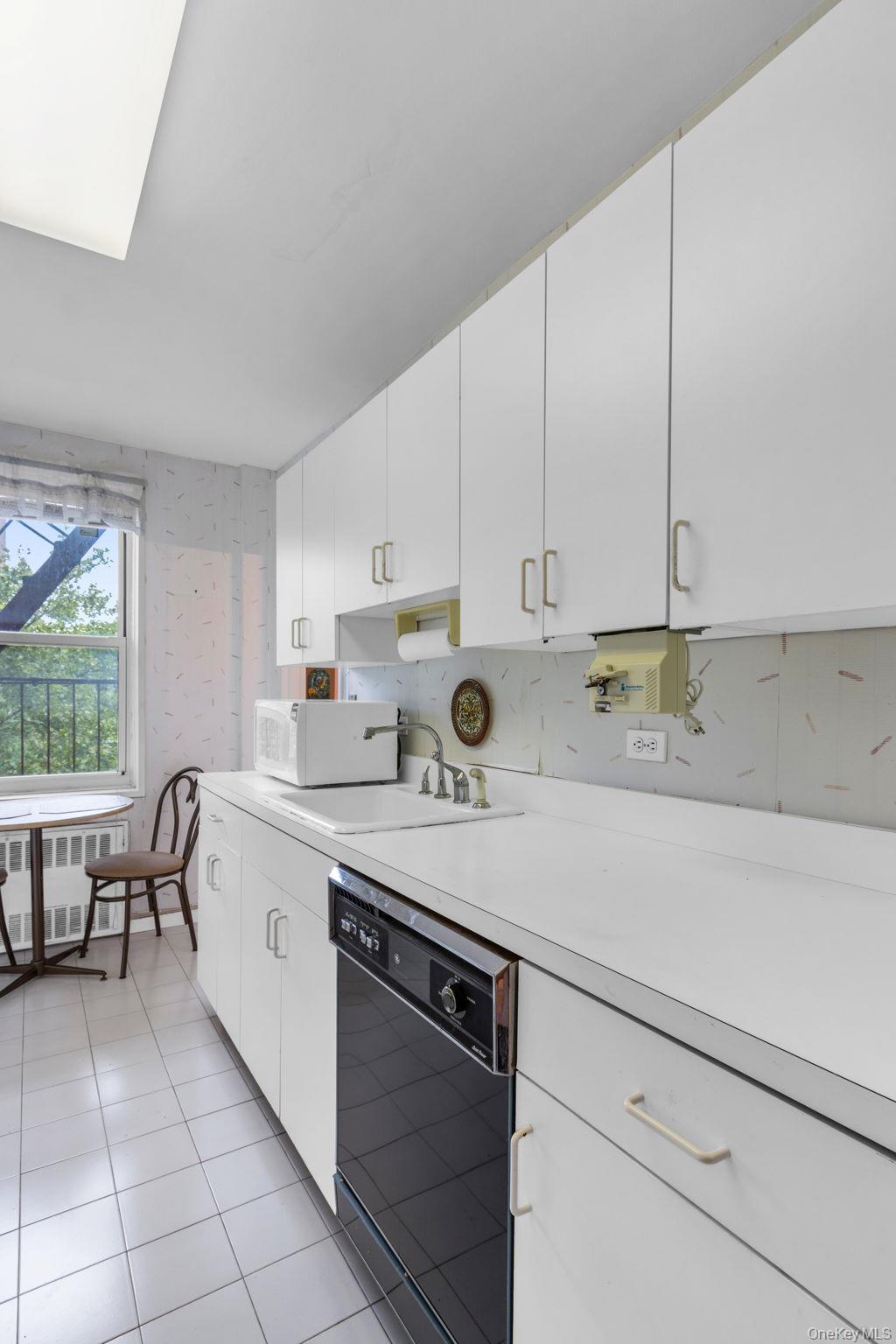 3901 Independence Avenue, Unit 4R Bronx, NY 10463 - Photo 12 of 35 a kitchen with a sink cabinets and window