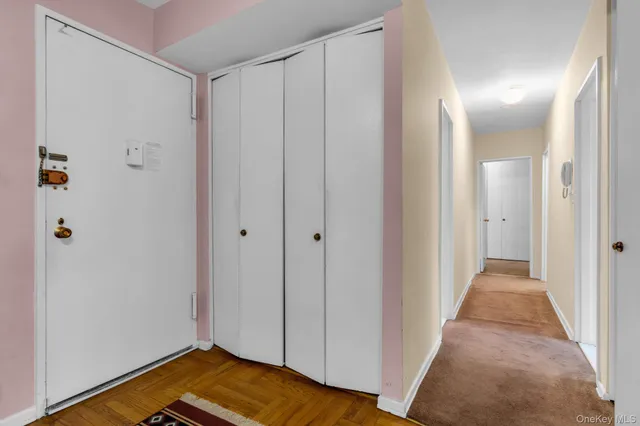 a view of a room with wooden floor