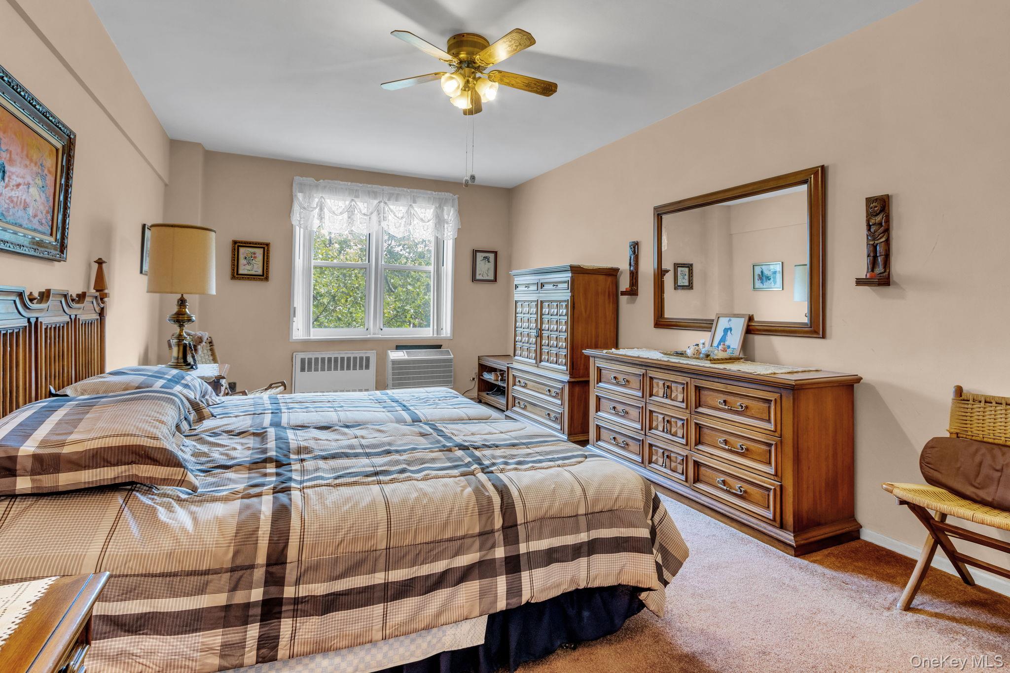 3901 Independence Avenue, Unit 4R Bronx, NY 10463 - Photo 19 of 35 a bedroom with a bed dresser and a window