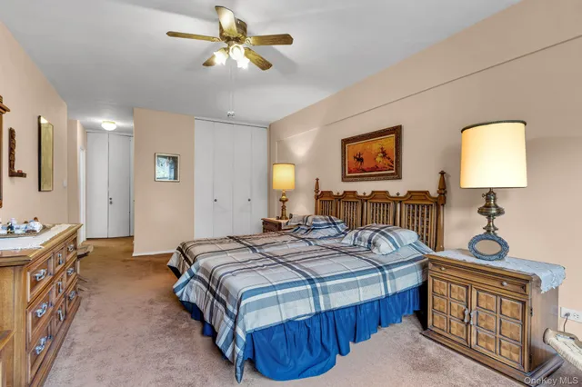 a bedroom with bed and window