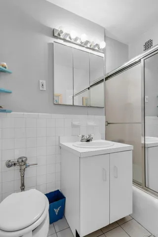 a bathroom with a sink a toilet and vanity