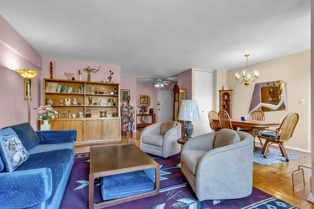 a living room with furniture rug and window