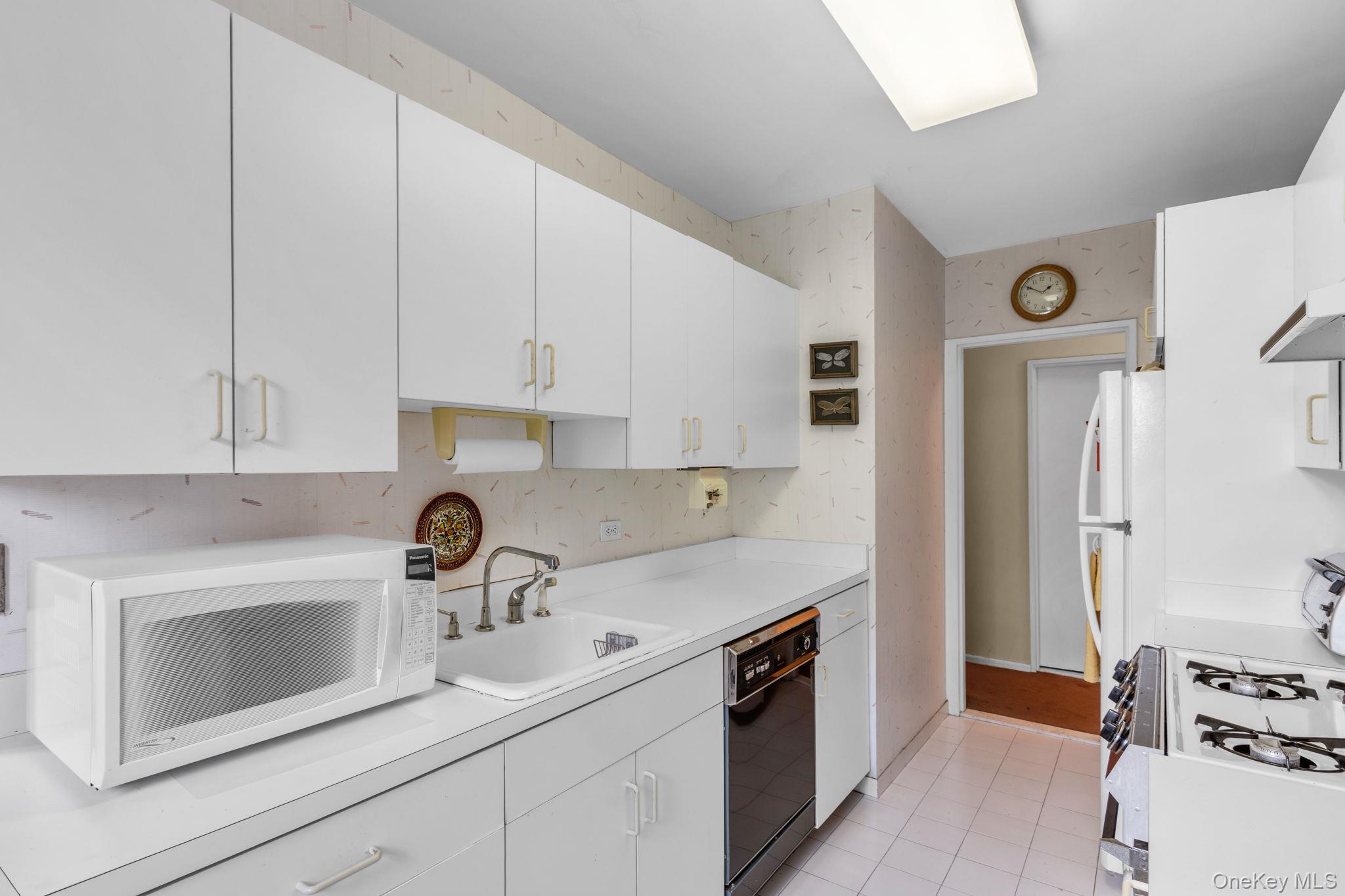 3901 Independence Avenue, Unit 4R Bronx, NY 10463 - Photo 8 of 35 a kitchen with stainless steel appliances granite countertop a sink stove and refrigerator