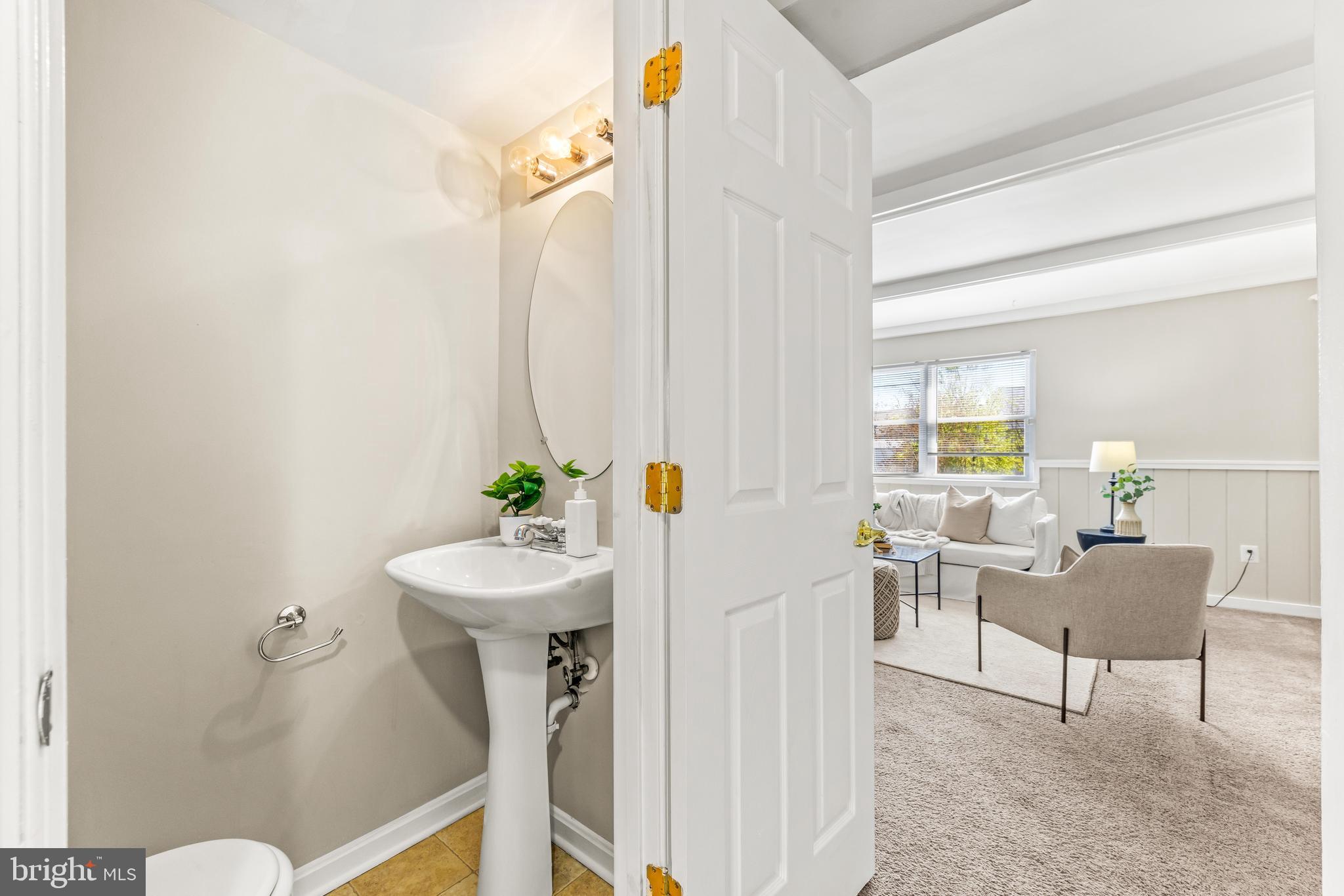 15 Bohn Court Rosedale, MD 21237 - Photo 12 of 31 a living room with furniture a chandelier and a sink