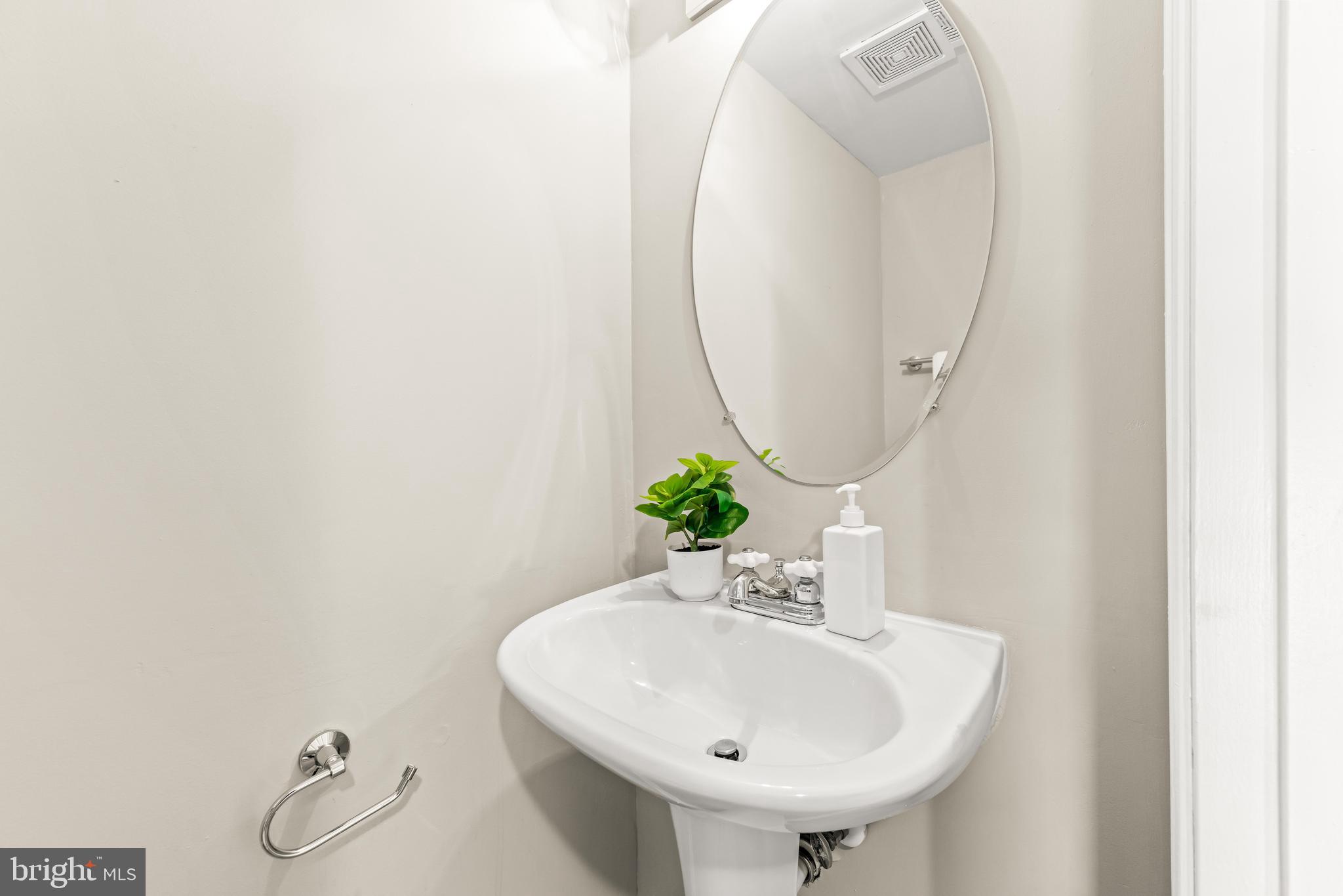 15 Bohn Court Rosedale, MD 21237 - Photo 13 of 31 a bathroom with a sink and a mirror