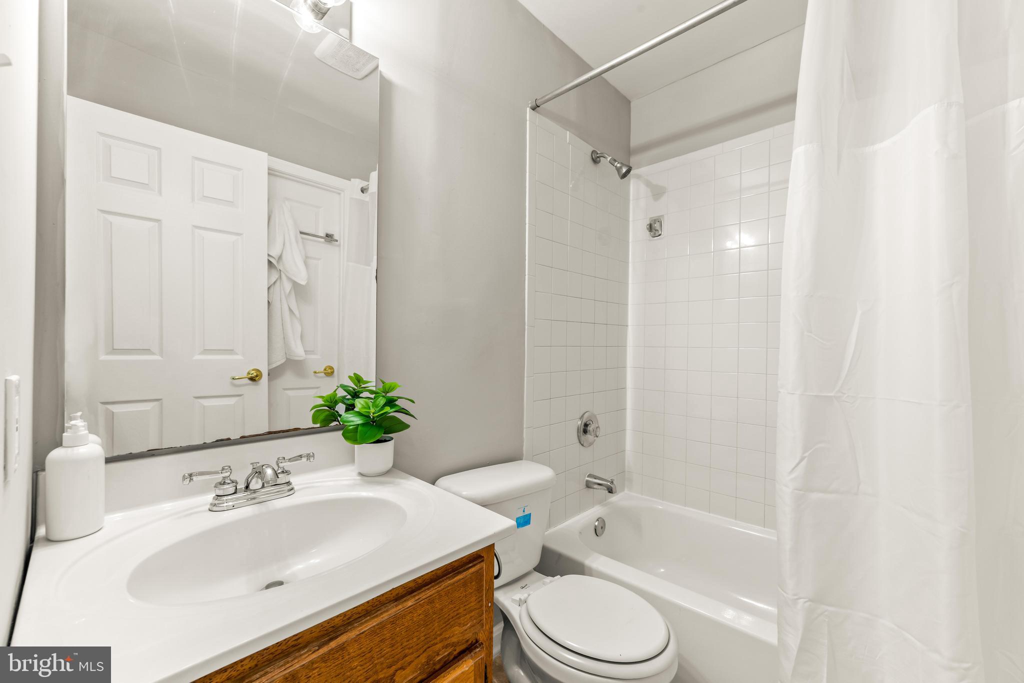 15 Bohn Court Rosedale, MD 21237 - Photo 20 of 31 a bathroom with a sink toilet and shower