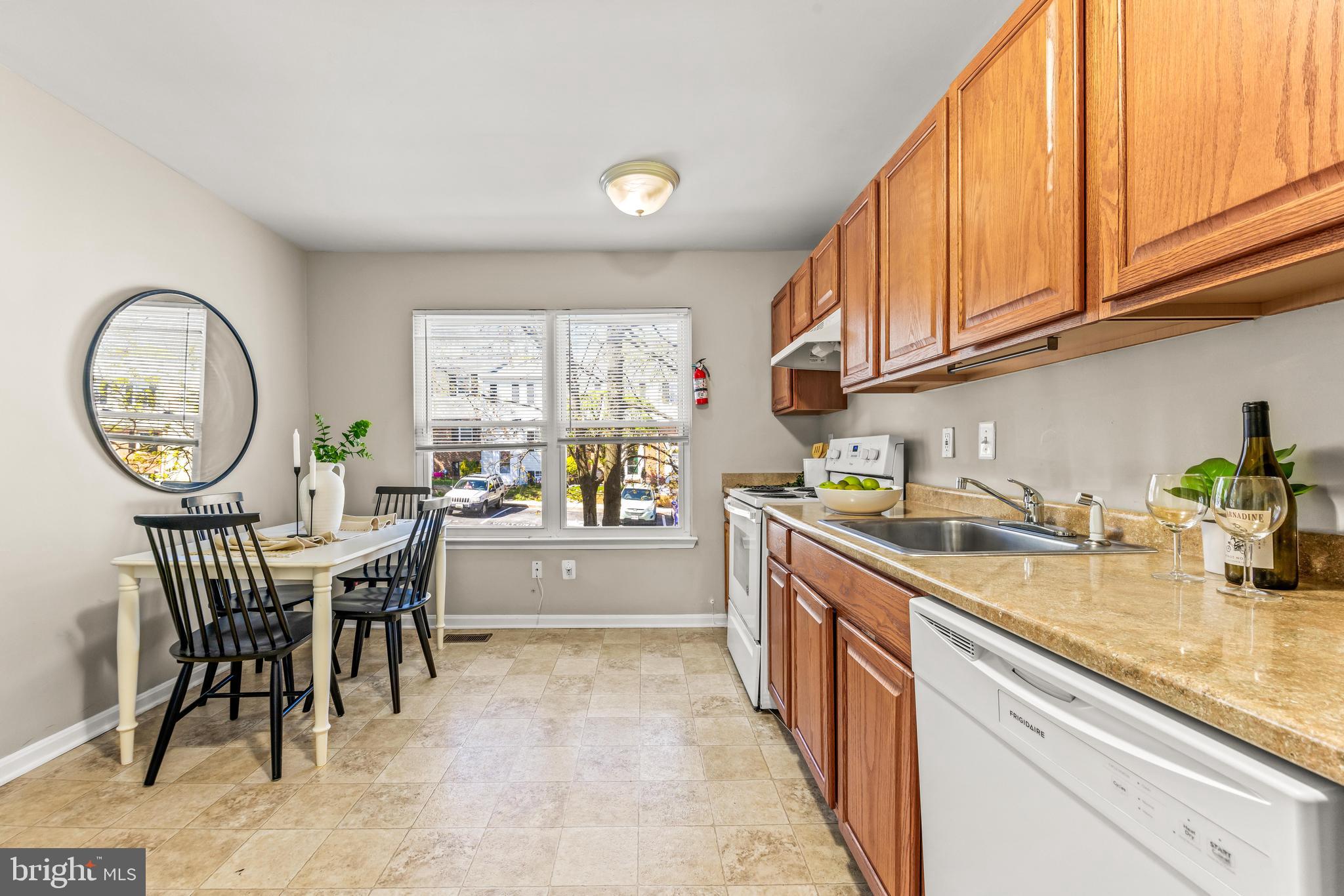 15 Bohn Court Rosedale, MD 21237 - Photo 2 of 31 a kitchen with a table chairs sink and cabinets