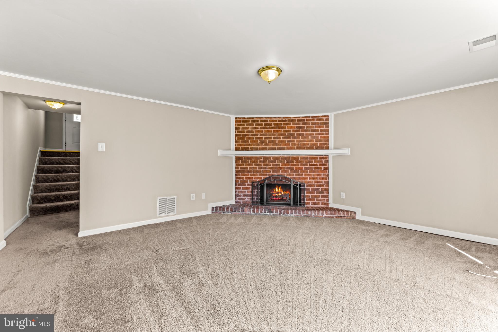 15 Bohn Court Rosedale, MD 21237 - Photo 23 of 31 an empty room with a fireplace