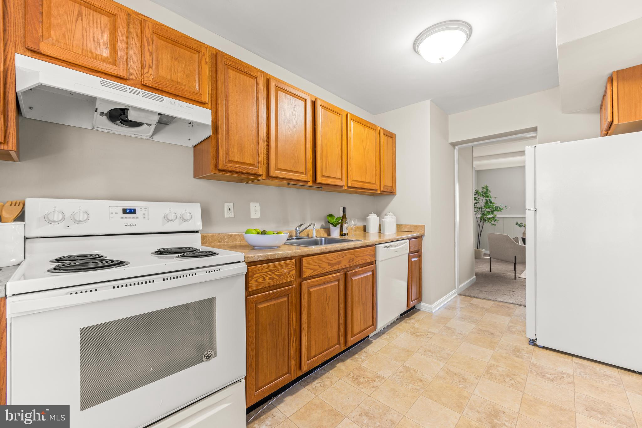 15 Bohn Court Rosedale, MD 21237 - Photo 4 of 31 a kitchen with a stove sink and cabinets