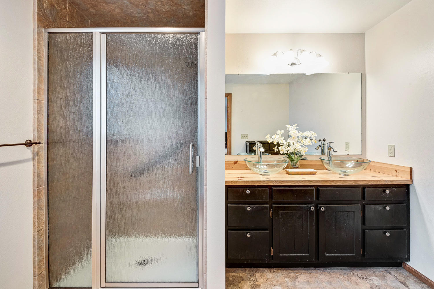 64736 Sylvan Loop Bend, OR 97701 - Photo 20 of 46 a bathroom with a sink and a mirror