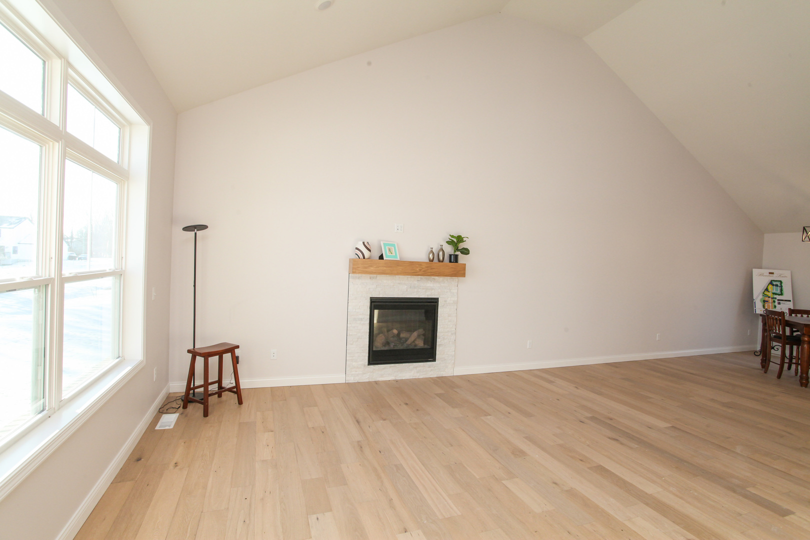 108 Dugan Trail Downs, IL 61736 - Photo 11 of 44 a view of empty room with wooden floor and fireplace