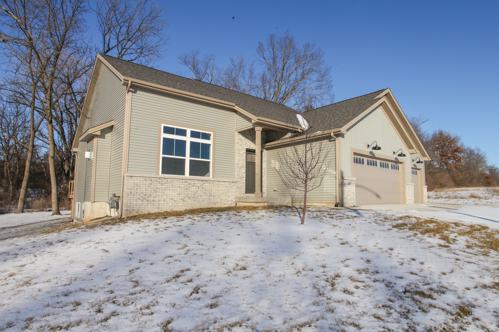 108 Dugan Trail Downs, IL 61736 - Photo 2 of 44 a house with trees in front of it