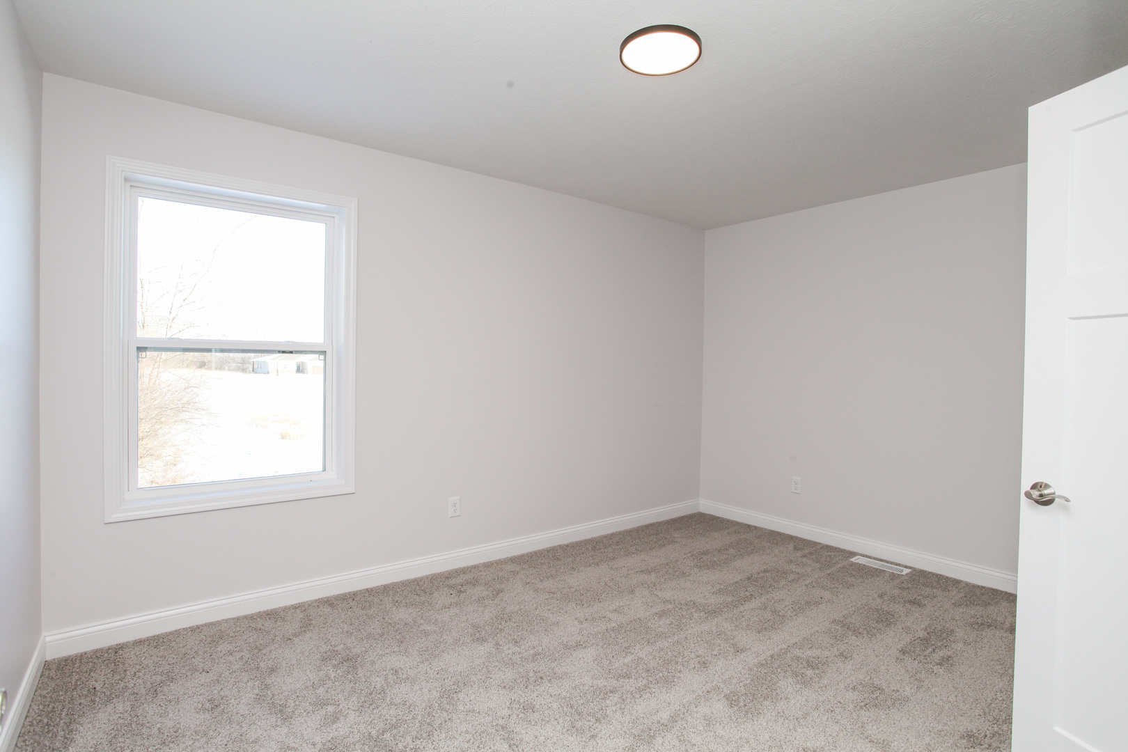 108 Dugan Trail Downs, IL 61736 - Photo 22 of 44 an empty room with a window