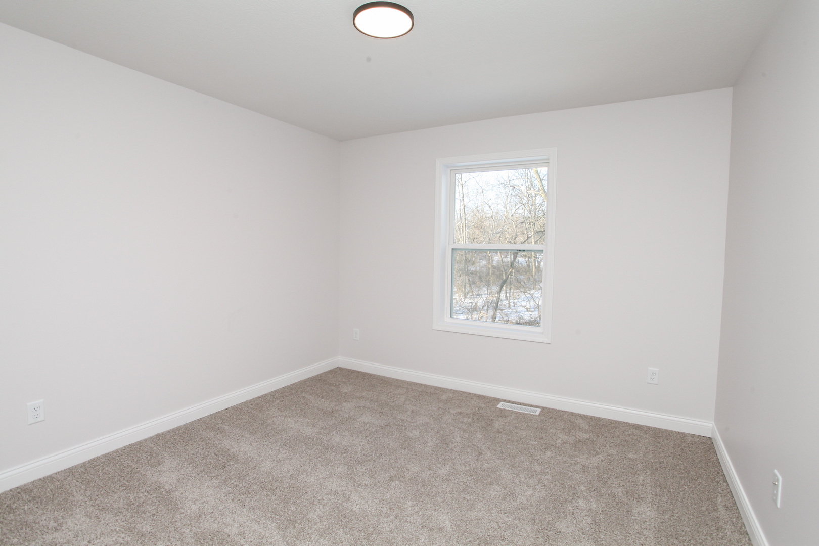 108 Dugan Trail Downs, IL 61736 - Photo 28 of 44 an empty room with windows