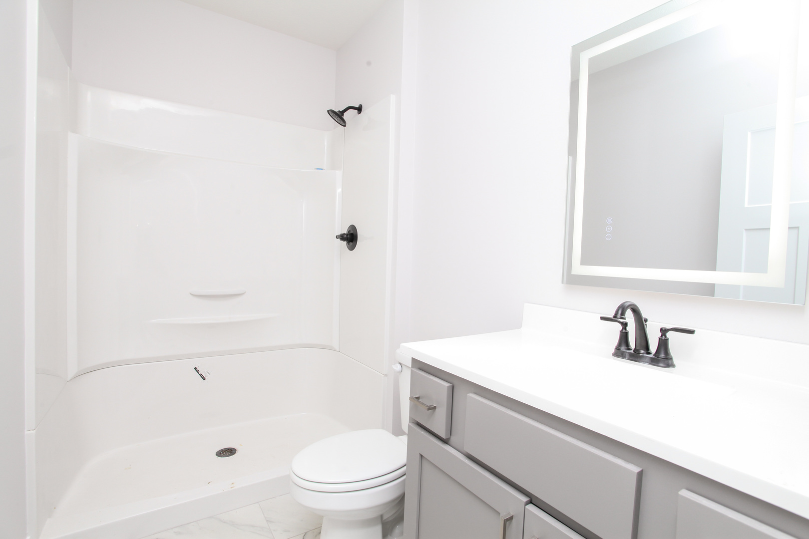108 Dugan Trail Downs, IL 61736 - Photo 33 of 44 a bathroom with a sink a toilet a shower and a mirror