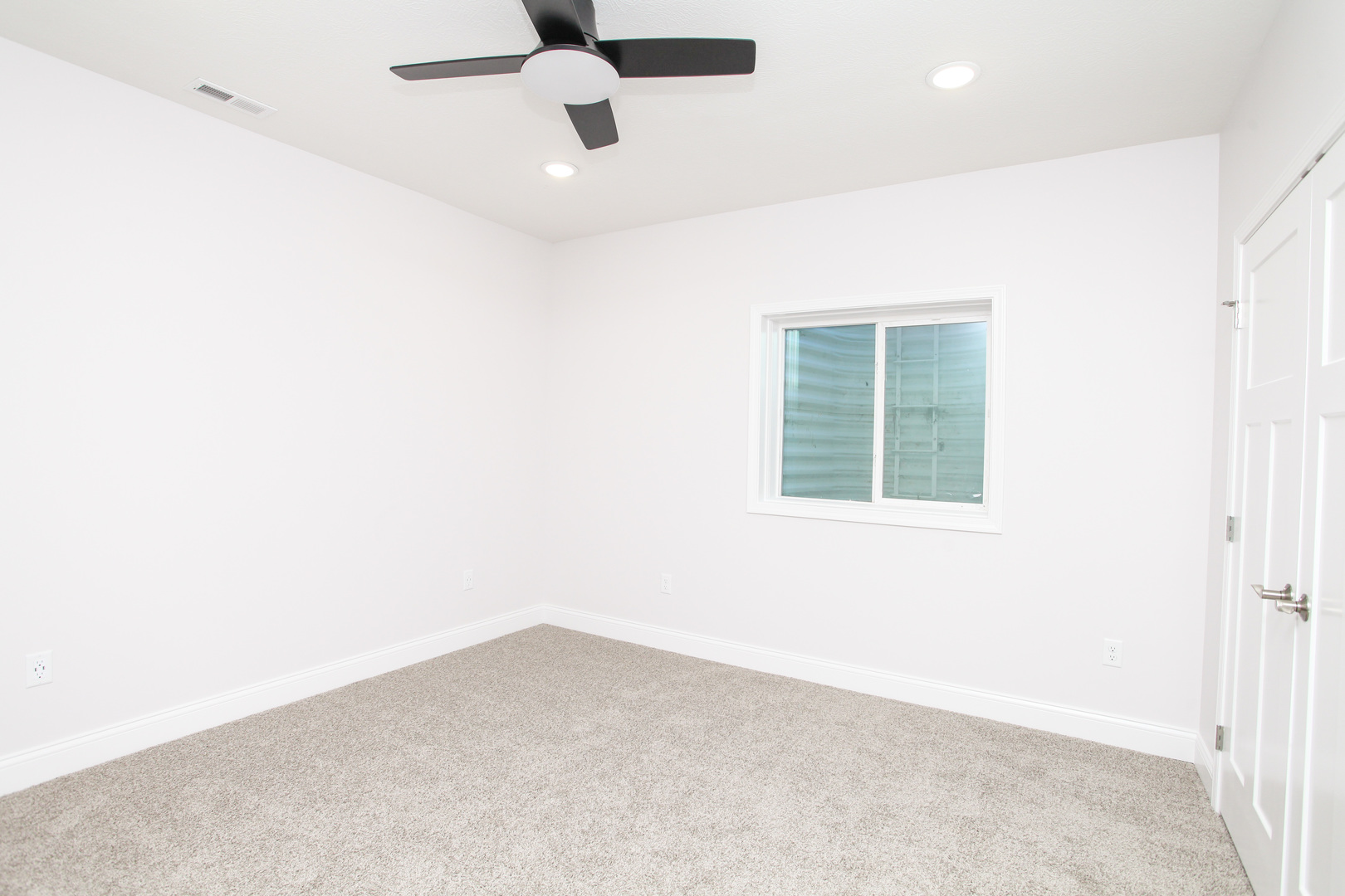 108 Dugan Trail Downs, IL 61736 - Photo 34 of 44 an empty room with a window and a ceiling fan