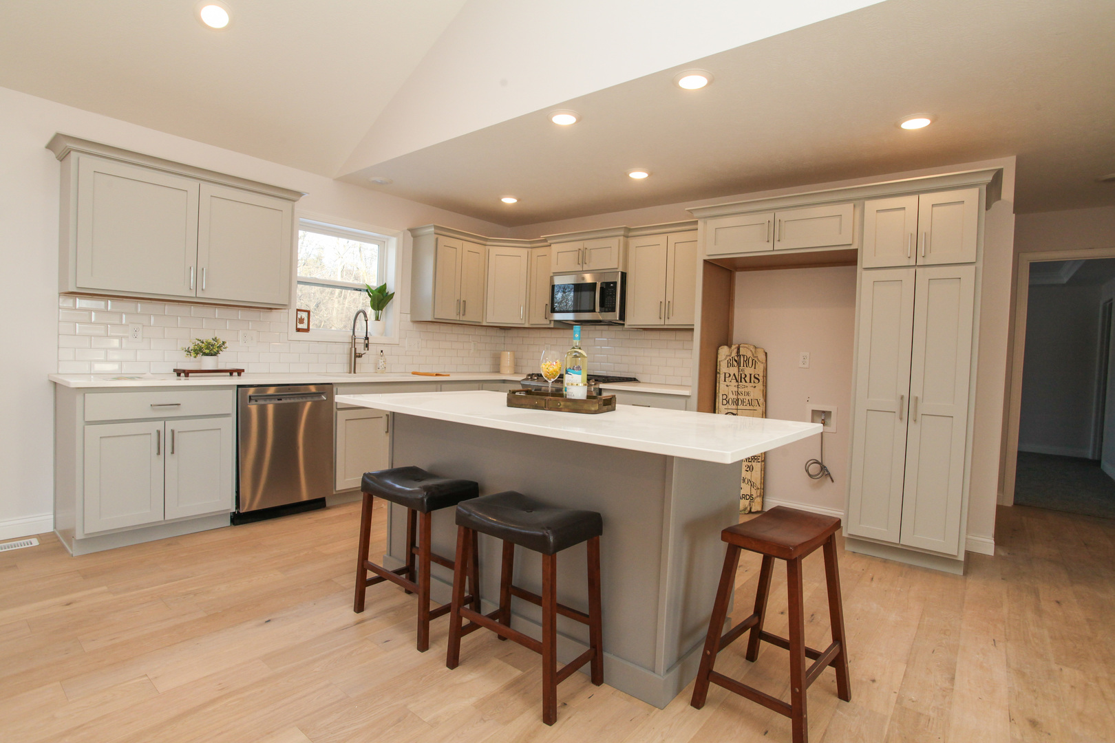 108 Dugan Trail Downs, IL 61736 - Photo 4 of 44 a kitchen with a sink a cabinets and chairs