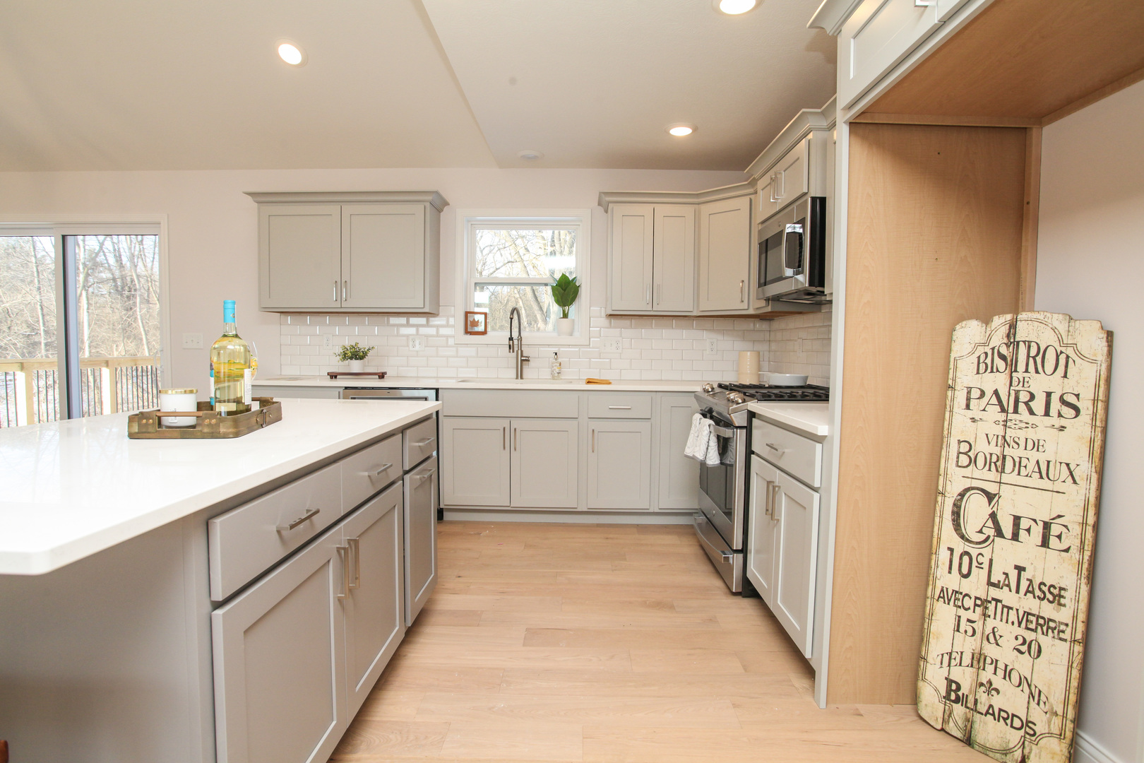 108 Dugan Trail Downs, IL 61736 - Photo 9 of 44 a kitchen with a sink stove and cabinets