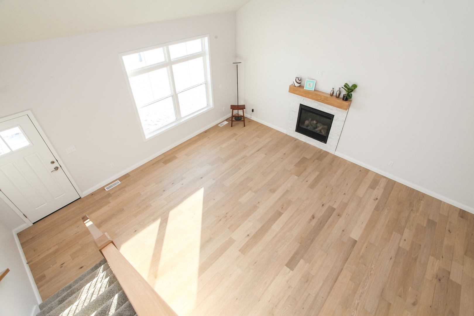 108 Dugan Trail Downs, IL 61736 - Photo 10 of 44 a view of a livingroom with wooden floor and a window