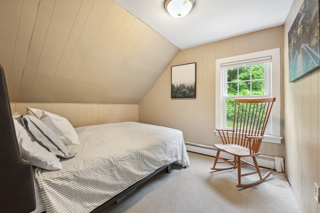 128 Pleasant Street Franklin, MA 02038 - Photo 13 of 19 a bedroom with a bed chair and a window