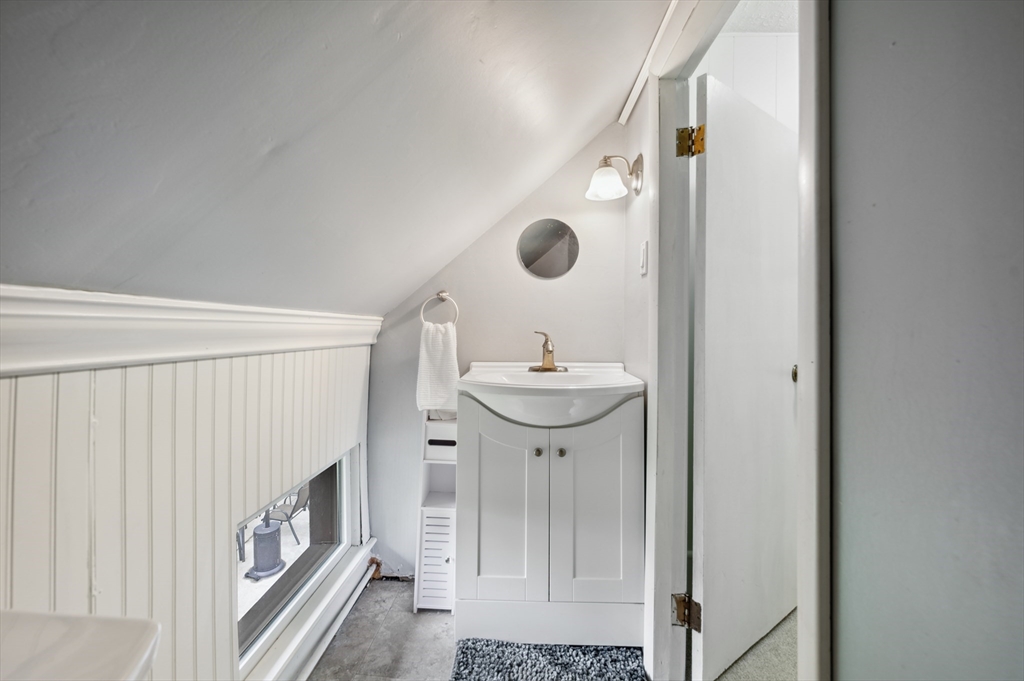 128 Pleasant Street Franklin, MA 02038 - Photo 15 of 19 a bathroom with a sink and a mirror