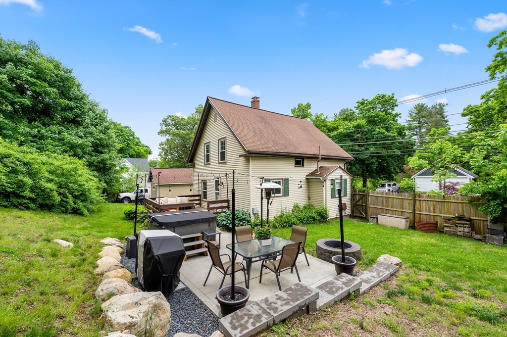 128 Pleasant Street Franklin, MA 02038 - Photo 18 of 19 a view of house with backyard and outdoor seating