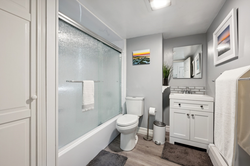 128 Pleasant Street Franklin, MA 02038 - Photo 9 of 19 a bathroom with a granite countertop sink toilet and shower