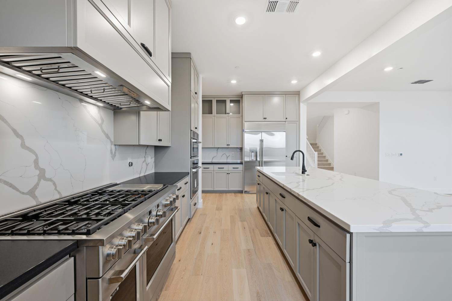 3034 Sidewinder Loop Rocklin, CA 95765 - Photo 12 of 37 a large kitchen with stainless steel appliances granite countertop a lot of counter space