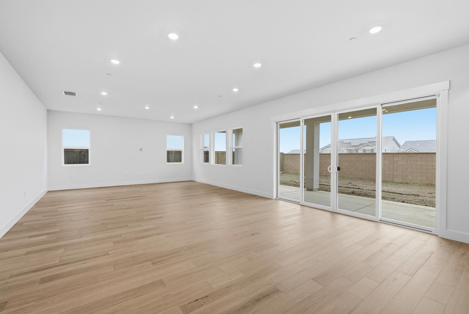 3034 Sidewinder Loop Rocklin, CA 95765 - Photo 14 of 37 an empty room with wooden floor and windows