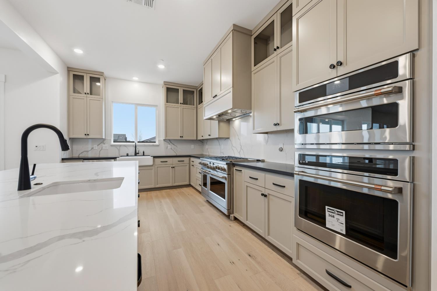 3034 Sidewinder Loop Rocklin, CA 95765 - Photo 17 of 37 a kitchen with stainless steel appliances granite countertop a stove top oven and sink