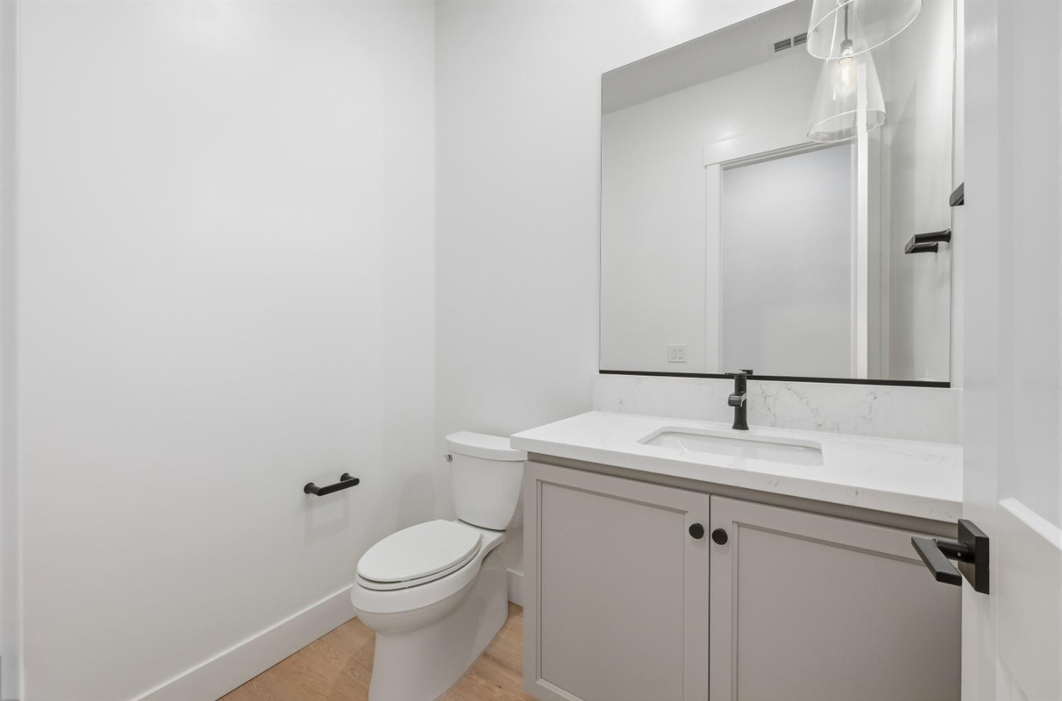 3034 Sidewinder Loop Rocklin, CA 95765 - Photo 20 of 37 a bathroom with a granite countertop toilet and a sink