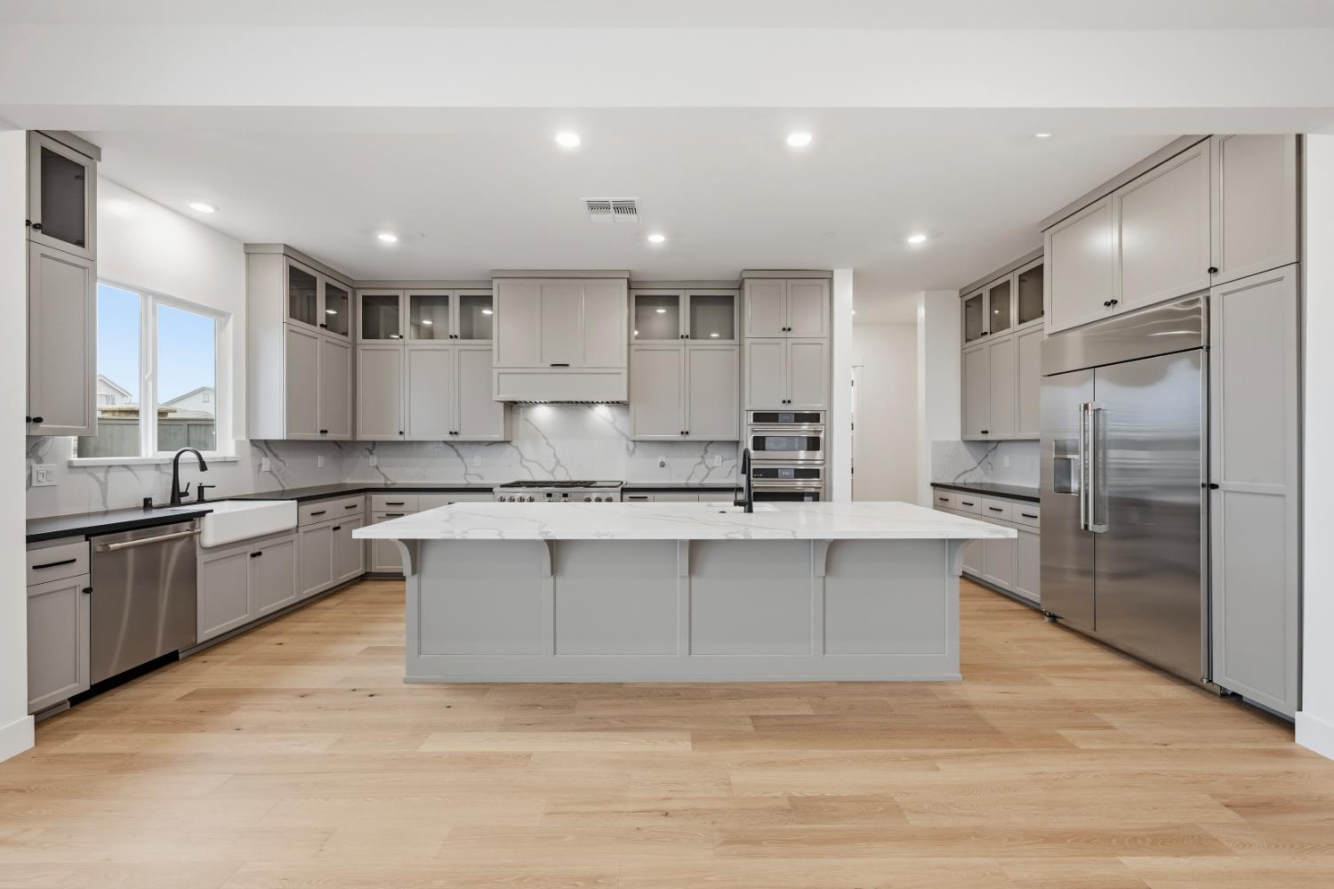 3034 Sidewinder Loop Rocklin, CA 95765 - Photo 2 of 37 a large kitchen with granite countertop a large counter top stainless steel appliances and cabinets