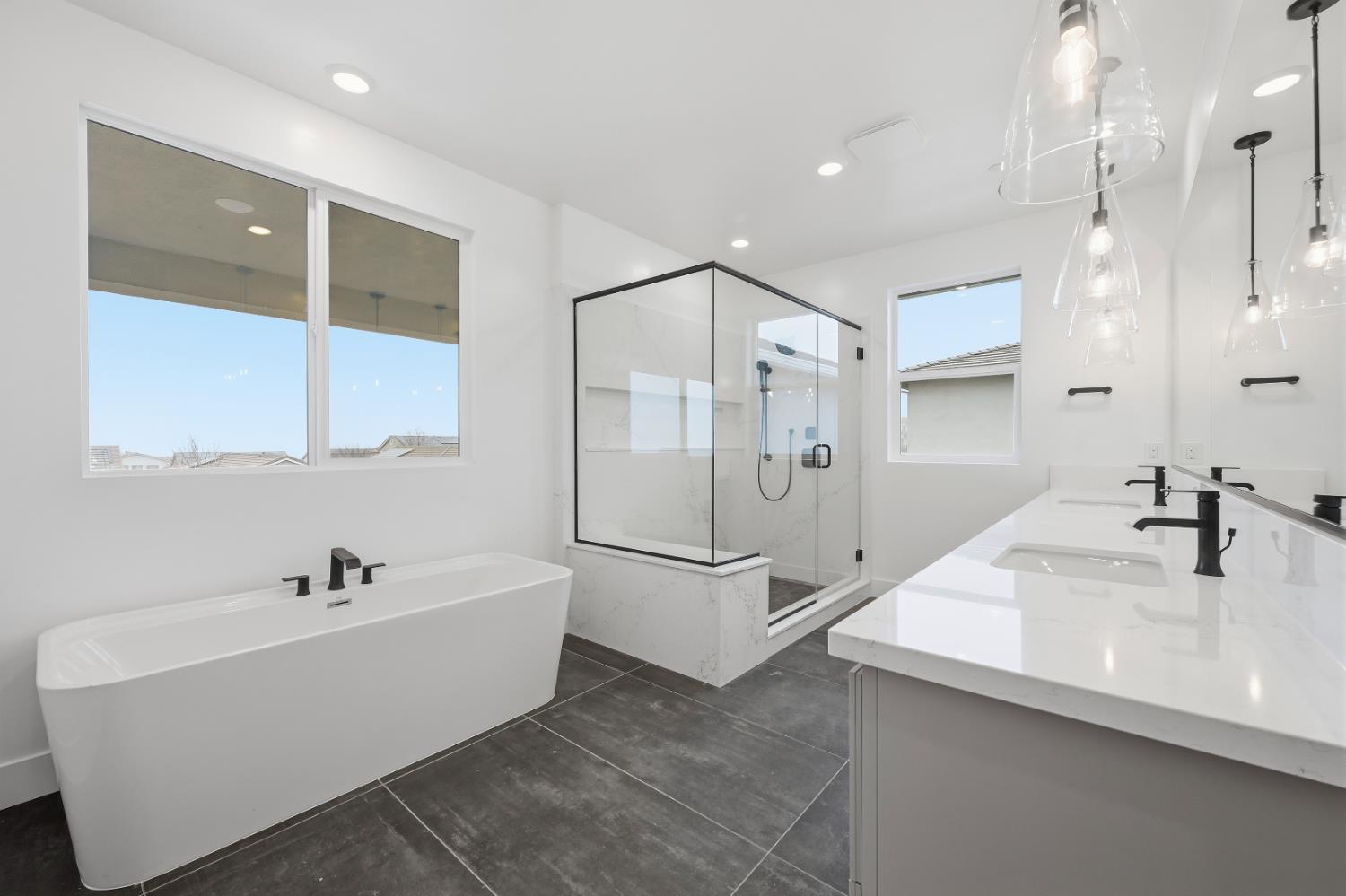 3034 Sidewinder Loop Rocklin, CA 95765 - Photo 34 of 37 a bathroom with a tub sink shower and mirror