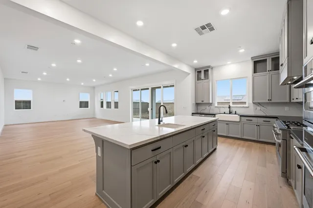 a bathroom with a double vanity sink mirror double and shower